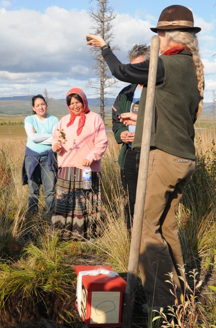 Cynthia rings a bell at the ceremonial burial of the Earth Treasure Vase in Alaska
