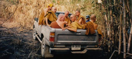 Thai Buddhist monks piled in a truck for the rugged treck to the monastary in Dtao Dum